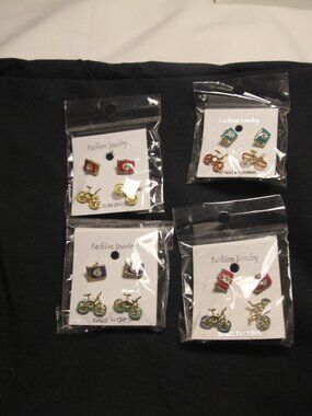 Earrings 8 for one price. Stud bicycles and cameras. New with packaging.
